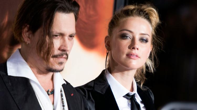 Johnny Depp et Amber Heard à Westwood, en Californie, ,le 21 novemnbre 2015 [VALERIE MACON / AFP/Archives]