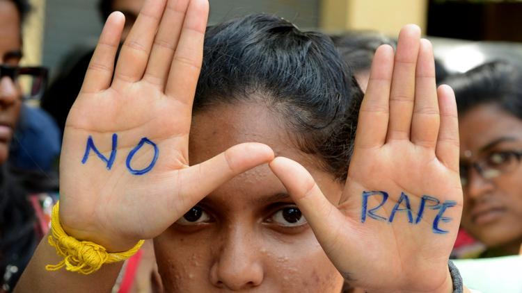 Des étudiants lors d'une manifestation contre le viol, à Hyderabad, en Inde, le 13 septembre 2013 [Noah Seelam  / AFP/Archives]
