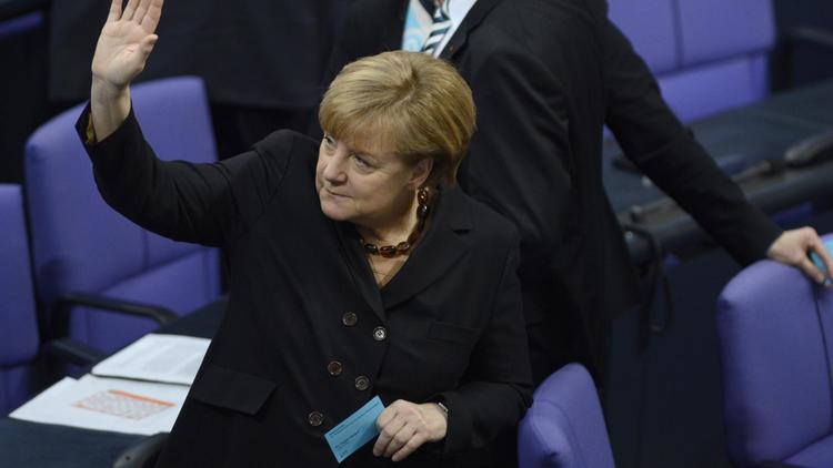 La chancelière Angela Merkel, le 17 décembre 2013 lors du vote au Bundestag [Johannes Eisele / AFP]