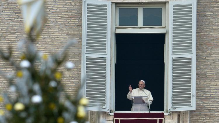 Le pape François le au balcon de ses appartements privés  22 décembre 2013 place Saint-Pierre à Rome [Alberto Pizzoli  / AFP/Archives]