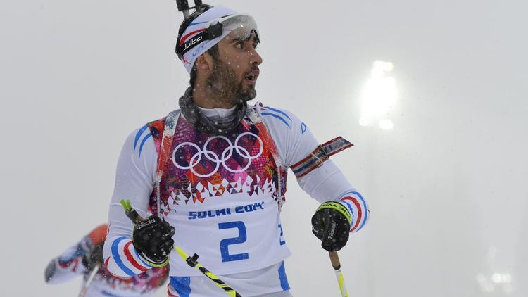 Martin Fourcade à l'arrivée de l'épreuve de mass-start de biathlon, le 18 février 2014 sur le site olympique de Laura à Rosa Khoutor [Odd Andersen / AFP]
