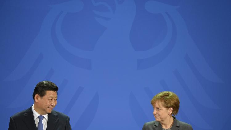 Le président chinois Xi Jinping et la chancelière allemande Angela Merkel, lors du conférence d epresse à Berlin le 28 mars 2014 [Odd Andersen / AFP]