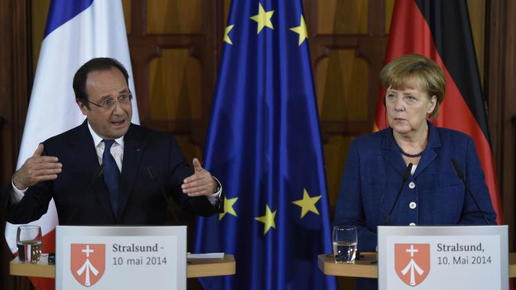 Francois Hollande et Angela Merkel le 10 mai 2014 lors d'un point de presse à Stralsund  [Odd Andersen / AFP]