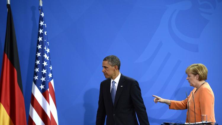 Le président américain Barack Obama et la chancelière Angela Merkel à l'issue d'une conférence de presse à Berlin, le 19 juin 2013 [Johannes Eisele / AFP/Archives]