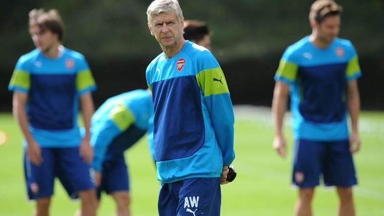 Arsène Wenger lors d'un entraînement d'Arsenal au nord de Londres, le 18 août 2014 [Olly Greenwood / AFP]