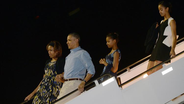 Le président américain Barack Obama et sa famille, à leur arrivée à Honolulu, Hawaii le 20 décembre 2013 [Jewel Samad / AFP]