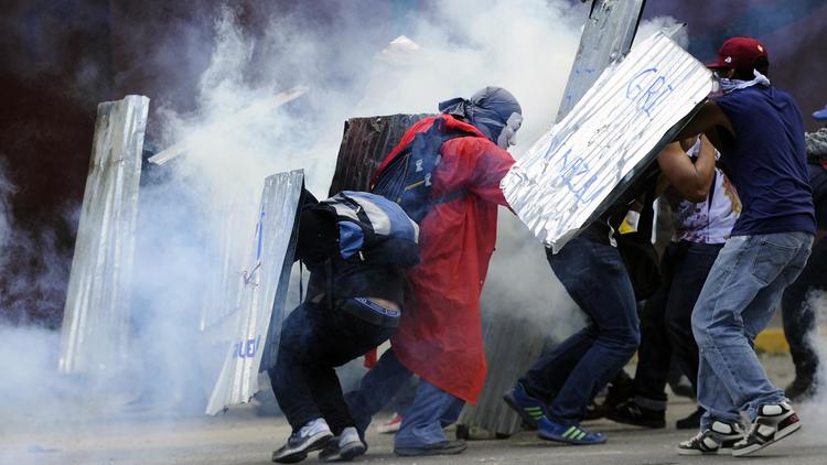 Des opposants au gouvernement vénézuélien du président Nicolas Maduro, lors d'une manifestation à Caracas le 2 mars 2014 [Leo Ramirez / AFP]