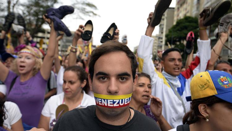 Manifestants contre le gouvernement du président Nicolas Maduro, le 16 avril 2014 [Juan Barreto / AFP]