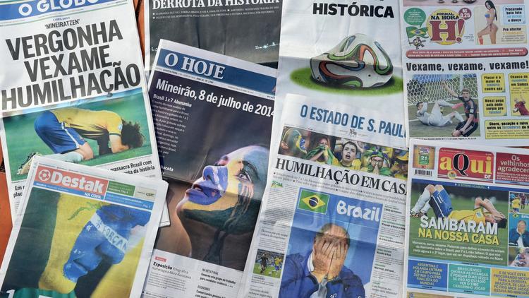 Les Unes des journaux brésiliens au lendemain de l'humiliation subie par la Seleçao face à l'Allemagne, le 9 juillet 2014 à Brasilia [Evaristo Sa / AFP]