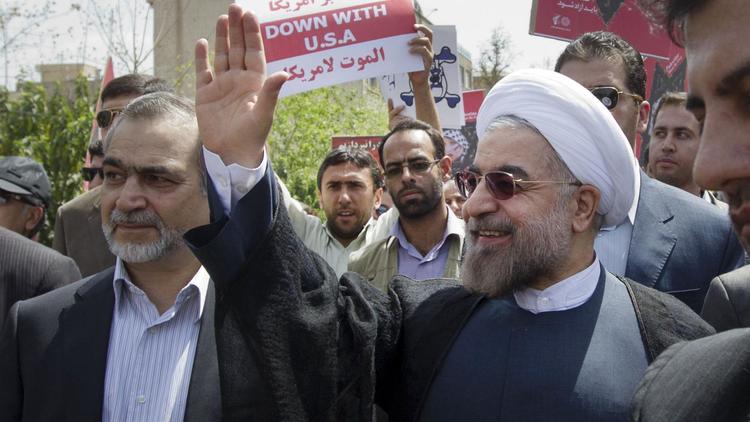 Le nouveau président iranien Hassan Rohani (d), le 2 août 2013 à Téhéran [Atta Kenare / AFP]