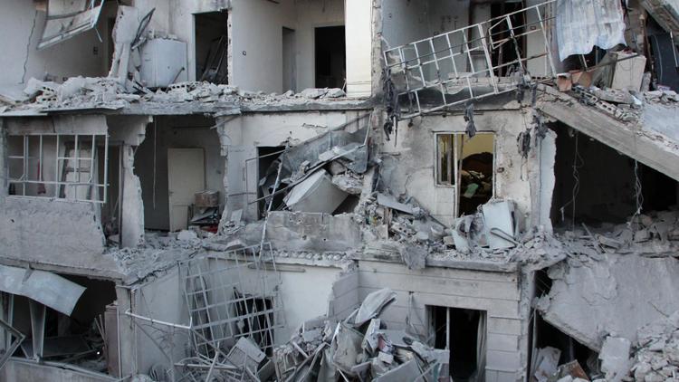 Immeubles détruits après un raid aérien sur Alep, le 28 mai 2014 [Baraa Al-Halabi / AFP]