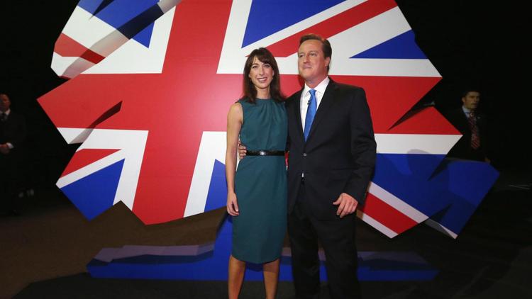 Le Premier ministre britannique David Cameron et son épouse Samantha à la convention annuelle du parti conservateur à Manchester le 2 octobre 2013 [Oli Scarff / Pool/AFP]