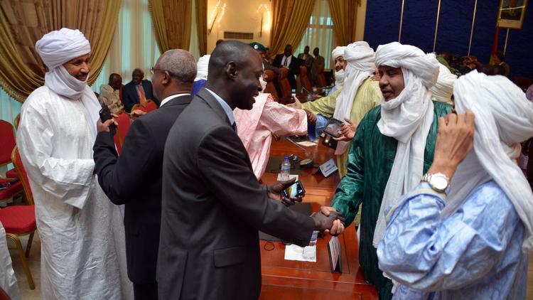 Des membres de la délégation malienne et des touaregs le 18 juin 2013 à Ouagadougou après la signature d'un accord  [Ahmed Ouoba  / AFP/Archives]