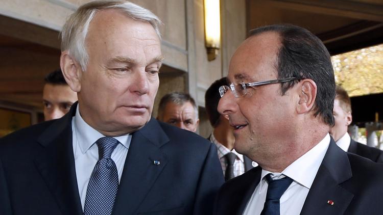 Le président Francois Hollande (d) et le Premier ministre Jean-Marc Ayrault, à Paris le 20 septembre 2013 [CHARLES PLATIAU / Pool/AFP/Archives]