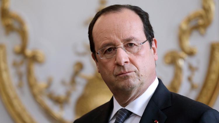 François Hollande le 3 janvier 2014 à l'Elysée, lors de la cérémonie du Nouvel An avec les membres du gouvernement [Philippe Wojazer / Pool/AFP]