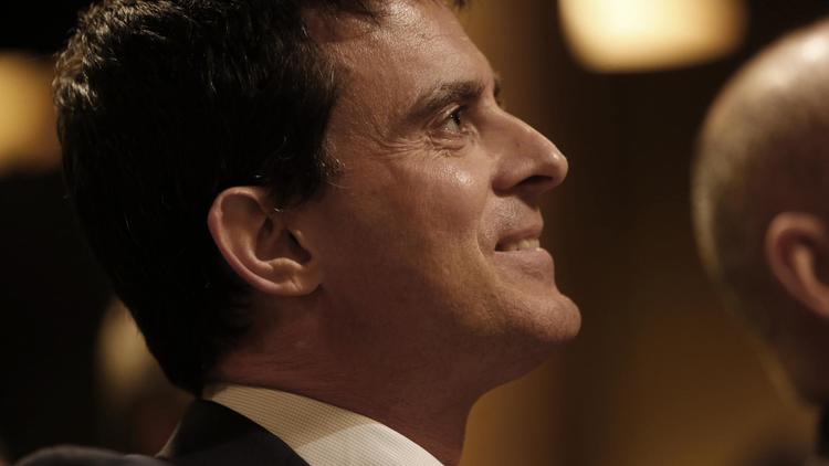 Le ministre de l'Intérieur, Manuel Valls, en meeting à Paris le 6 mars 2014 [Thomas Samson / AFP/Archives]