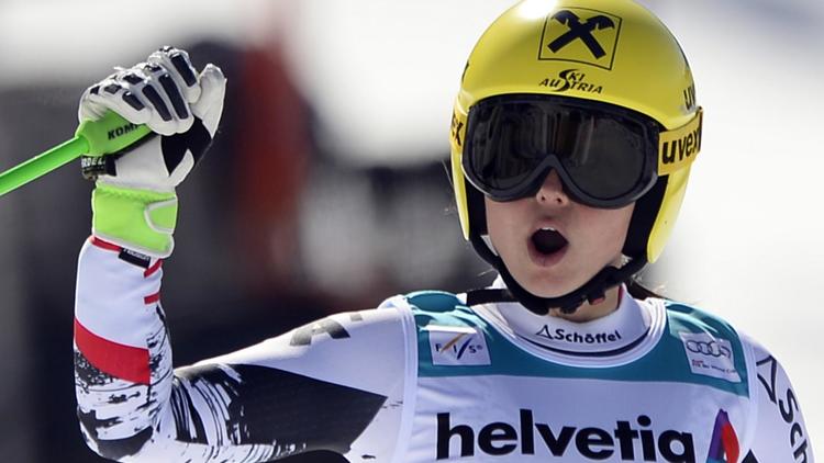 L'Autrichienne Anna Fenninger réagit après sa 2e place sur le super-G de Lenzerheide, le 13 mars 2014 en Suisse, synonyme de victoire finale au classement général de la Coupe du monde de ski alpin [Fabrice Coffrini / AFP]