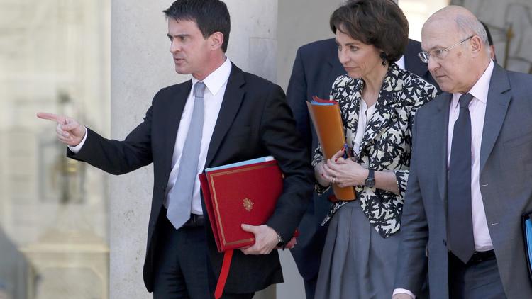 Manuel Valls, Marisol Touraine et  Michel Sapin le 16 avril 2014 à la sortie du Conseil des ministres à l'Elysée à Paris [Patrick Kovarik / AFP/Archives]