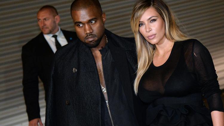 Le musicien américain Kanye West et sa compagne Kim Kardashian, le 29 septembre 2013 à Paris  [Pierre Andrieu / AFP/Archives]