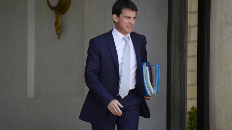Le Premier ministre Manuel Valls quitte l'Elysée à Paris le 11 juin 2014 [Bertrand Guay / AFP/Archives]