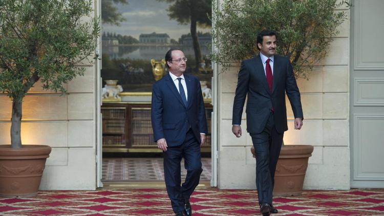 Le président français François Hollande reçoit la visite officielle à l'Elysée de l'émir, cheikh Tamim Ben Hamad Al-Thani, le 23 juin 2014 [Alain Jocard / pool/AFP]
