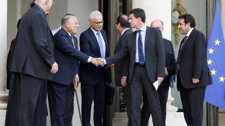 Manuel Valls entre Stanislas Lalanne, Dalil Boubakeur et Joël Mergui sur le perron de l'Elysée le 21 juillet 2014 à Paris  [François Guillot / AFP]