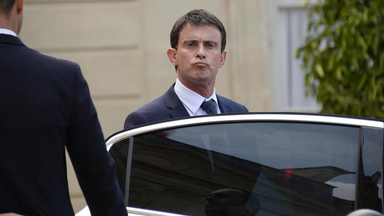 Le Premier ministre Manuel Valls quitte le Palais de l'Elysée, le 24 juillet 2014 à Paris [Bertrand Guay / AFP/Archives]