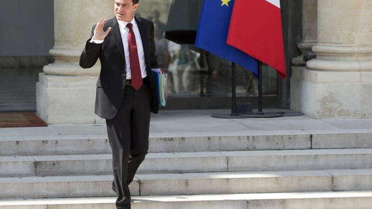 Manuel Valls quitte l'Elysée à l'issue du Conseil des ministres, le 30 juillet 2014 à Paris [Kenzo Tribouillard / AFP/Archives]