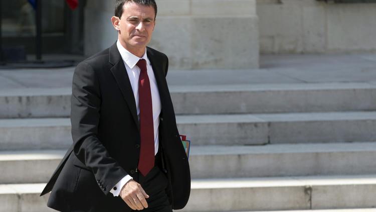 Le premier ministre français Manuel Valls quitte le Palais de l'Elysée à Paris, le 30 juillet 2014 [Kenzo Tribouillard / AFP/Archives]
