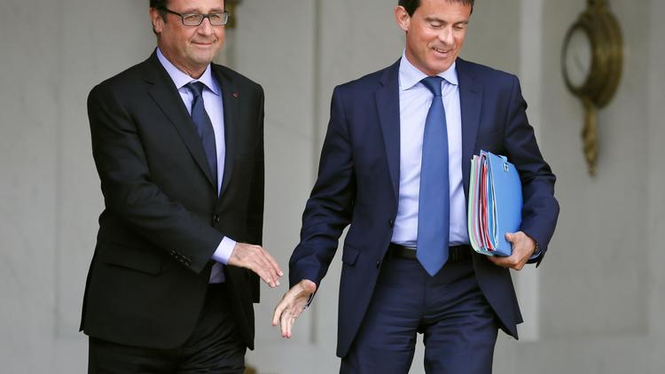 François Hollande et Manuel Valls  à la sortie du conseil des ministres le 20 août 2014 sur le perron de l'Elysée à Paris [Patrick Kovarik / AFP/Archives]