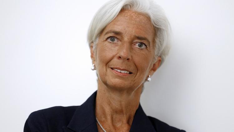 Christine Lagarde dans le bureau de son avocat à Paris, le 27 août 2014, peu après l'annonce de sa mise en examen pour "négligence" dans l'affaire de l'arbitrage Tapie [Thomas Samson / AFP]