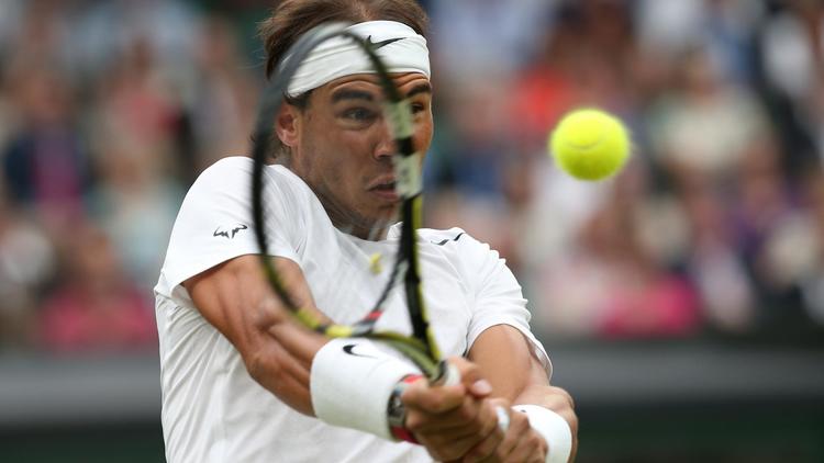 L'Espagnol Raphaël Nadal face à Mikhail Kukushkin lors du 3e tour du tournoi de Wimbledon le 28 juin 2014 à Wimbledon [Andrew Yates / AFP/Archives]