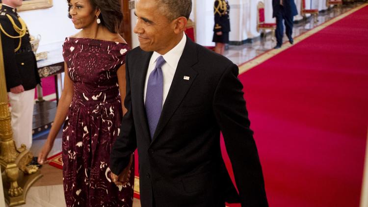 Le président Barack Obama et sa femme Michelle, le 10 juillet 2013 lors d'une cérémonie à Washington.   [Mandel Ngan / AFP]