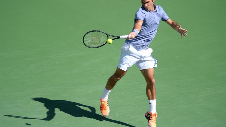 Le Suisse Roger Federer face à l'Ukrainien Alexandr Dolgopolov lors du tournoi d'Indian Wells, le 15 mars 2014 [Joe Klamar / AFP]