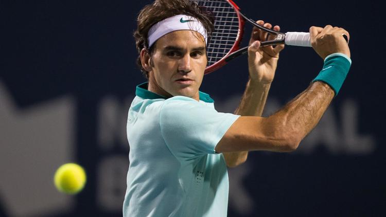 Roger Federer face à Feliciano Lopez lors des demi-finales du Masters 1000 de Toronto, le 9 août 2014 [Geoff Robins / AFP]