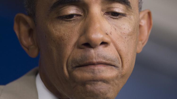 Barack Obama en conférence de presse à Washington le 28 aout 2014 a reconnu sans détour que les Etats-Unis n'avaient "pas encore de stratégie" et n'étaient pas prêts à ce stade à attaquer l'Etat islamique (EI) en Syrie [Saul Loeb / AFP]