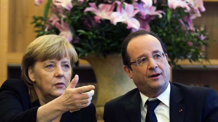 Angela Merkel et François Hollande, le 22 janvier 2013 à l'ambassade de France à Berlin [Thomas Peter / Pool/AFP]