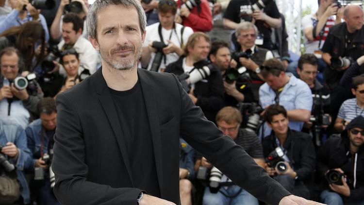 Le réalisateur Jérôme Salle pose, le 26 mai 2013 à Cannes, pour la présentation du film "Zulu" [Valery Hache / AFP]