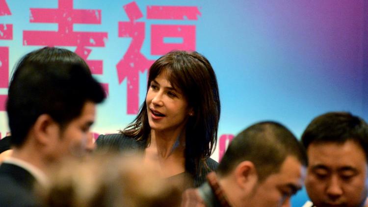 Sophie Marceau pendant une conférence de presse à Pékin, le 3 décembre 2012, pour promouvoir son dernier film "Un bonheur n'arrive jamais seul" [Goh Chai Hin / AFP]