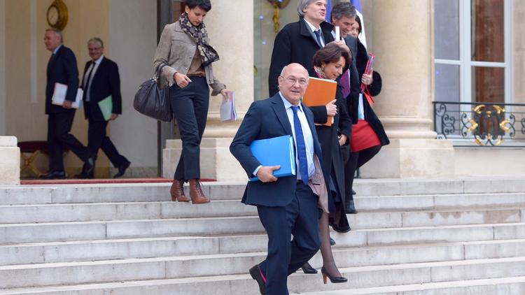 Michel Sapin (c) à la sortie de l'Elysée, le 4 janvier 2013 [Miguel Medina / AFP]