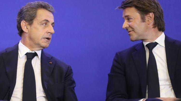 François Baroin (d) et Nicolas Sarkozy, assistent à une réunion de l'Association des maire de France à Paris, le 1er juin 2016 [JACQUES DEMARTHON / AFP]