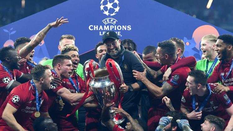 La joie de l'entraîneur de Liverpool Jurgen Klopp (c) et de ses joueurs après avoir remporté la Ligue des champions aux dépens de Tottenham, le 1er juin 2019 à Madrid [Paul ELLIS / AFP]