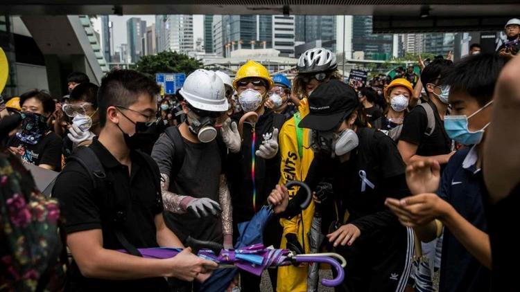 Protesters remained in control of key roads in Hong Kong on Monday morning [ISAAC LAWRENCE / AFP]