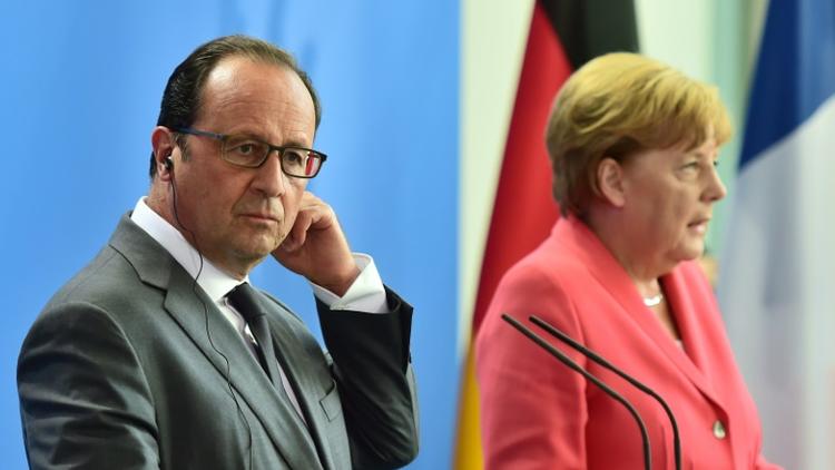 Le président François Hollande et la chancelière Angela Merkel lors d'une conférence de presse le 24 août 2015 à Berlin [JOHN MACDOUGALL / AFP/Archives]