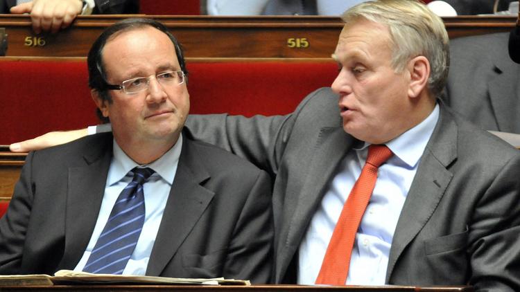 François Hollande et Jean-Marc Ayrault, alors député, à l'Assemblée National le 23 février 2010 à Paris  [Mehdi Fedouach / AFP/Archives]