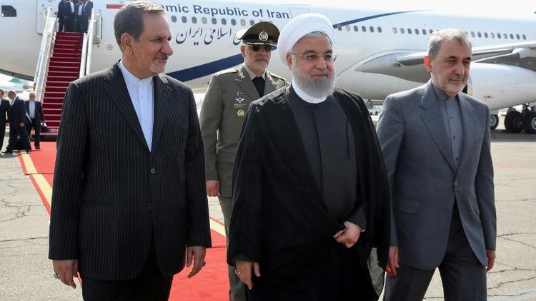 Photo fournie par la présidence iranienne montrant le président iranien Hassan Rohani (centre) à son arrivée à Téhéran, le 27 septembre 2019 [- / Iranian Presidency/AFP]
