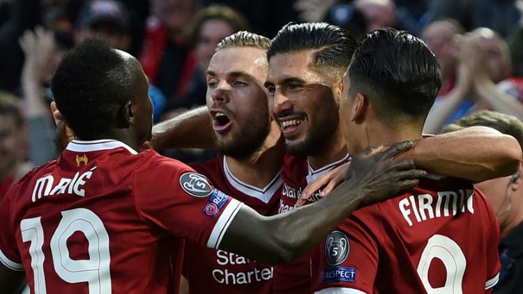 Les joueurs de Liverpool se congratulent après un but d'Emre Can face à Hoffenheim en barrage retour de la Ligue des champions, le 23 août 2017 à Anfield [Oli SCARFF                           / AFP]