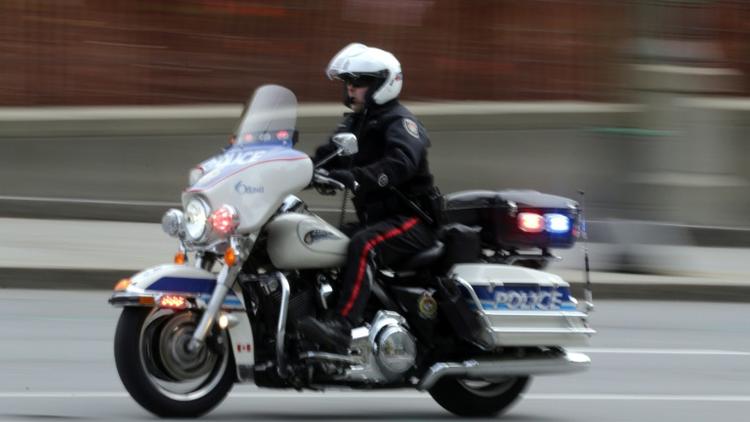 Un motard de la police dans les rues d'Ottawa au Canada, le 22 octobre 2014 [MIKE CARROCCETTO / Getty/AFP/Archives]