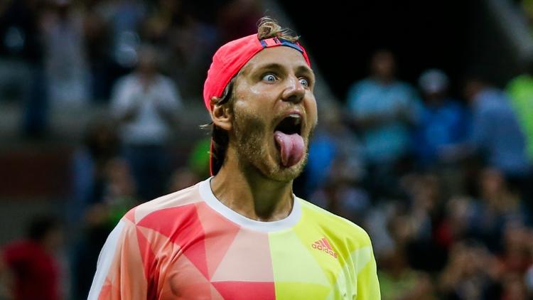 Lucas Pouille célèbre sa victoire face à Rafael Nadal, le 4 septembre 2016 à New York [EDUARDO MUNOZ ALVAREZ / AFP]